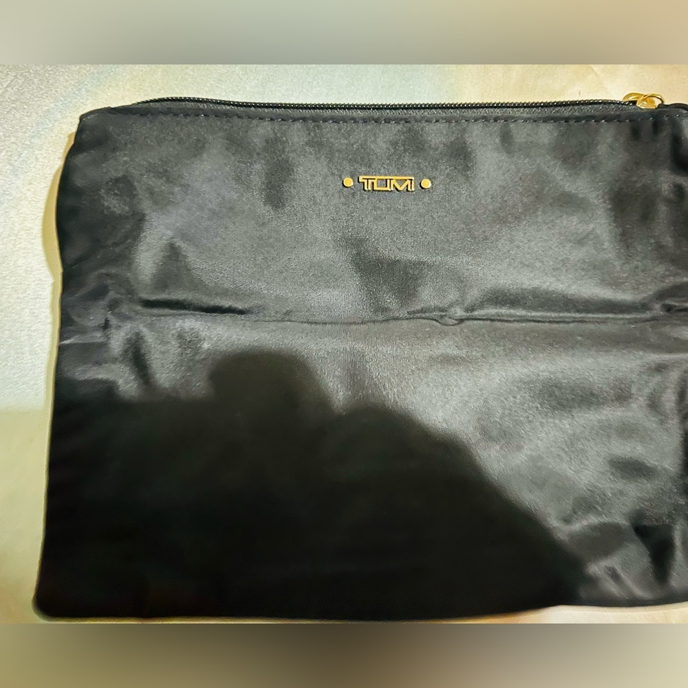 TUMI Black nylon zip bag. 7x9in. New condition, never used.